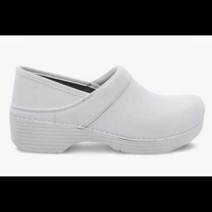 Dansko white nursing shoes.